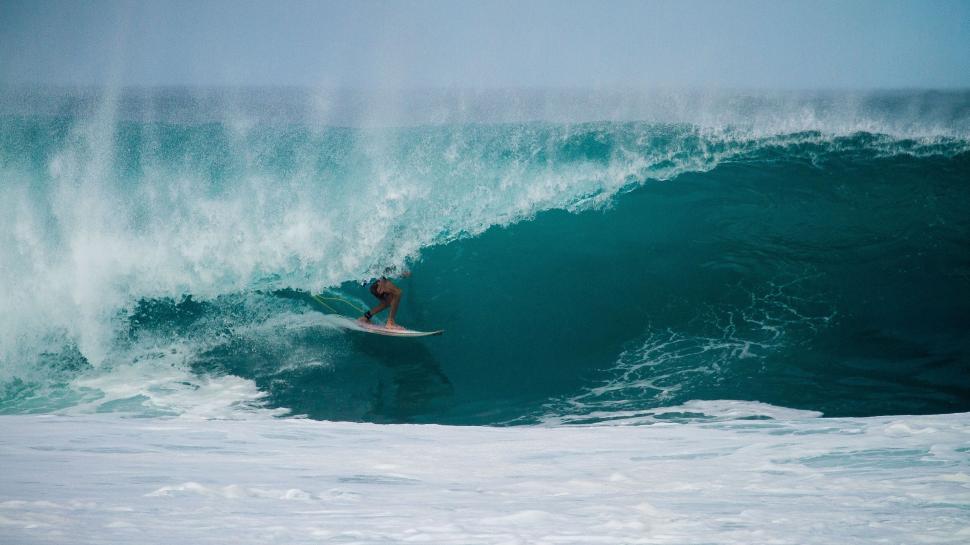 Free Image of Surfer in a large barrel wave 
