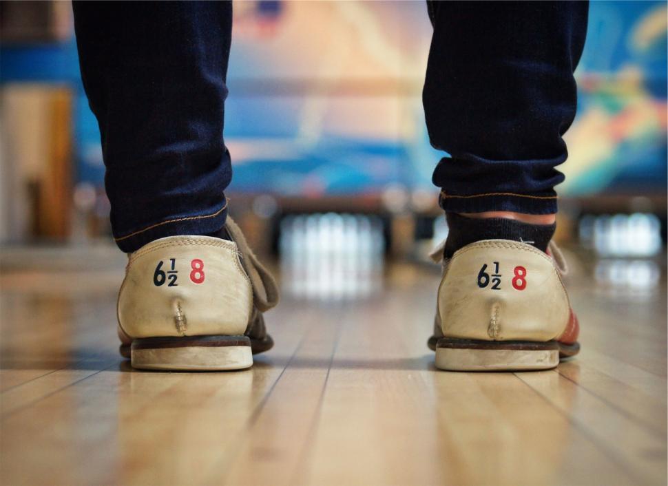 Free Image of Retro bowling shoes on wooden floor 