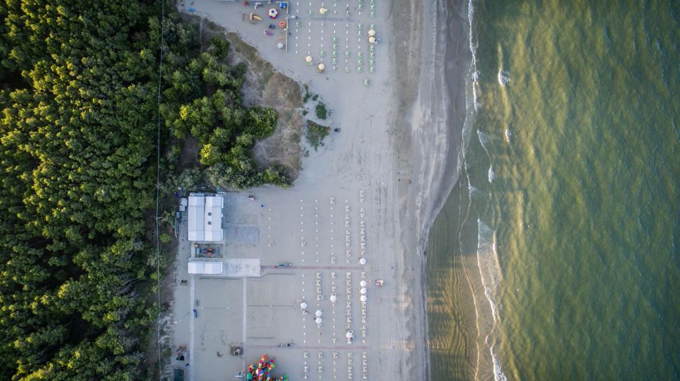 Free Image of Beach resort from above with parking and shoreline 