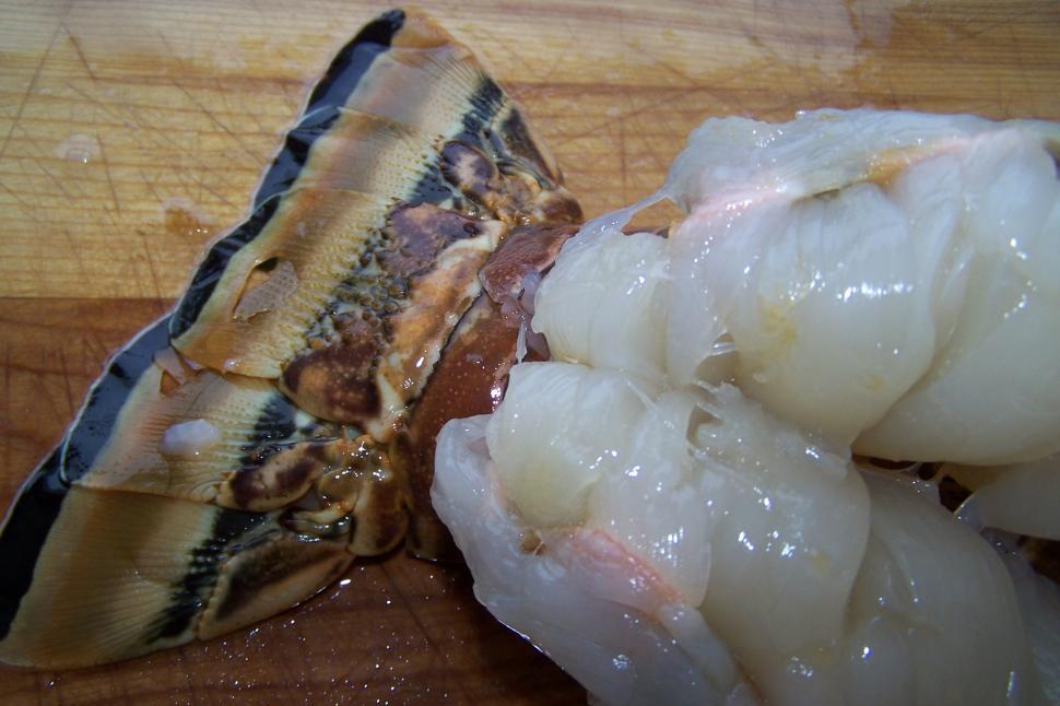 Free Image of Split Lobster Tail on Cutting Board 