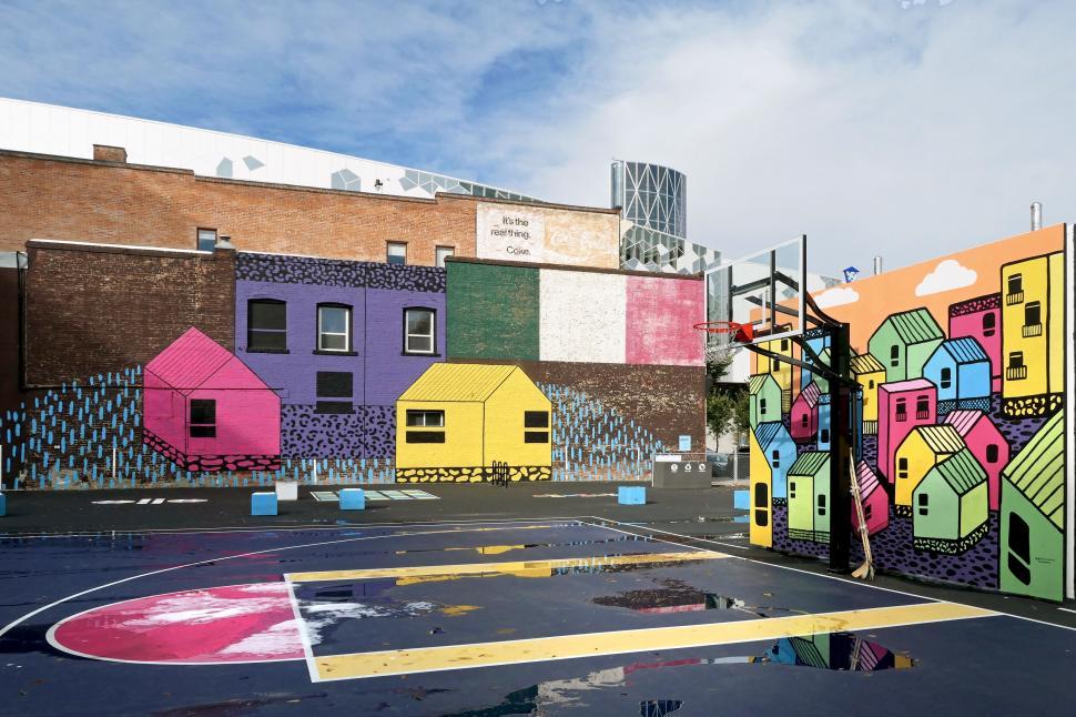 Free Image of Colorful mural on urban basketball court 
