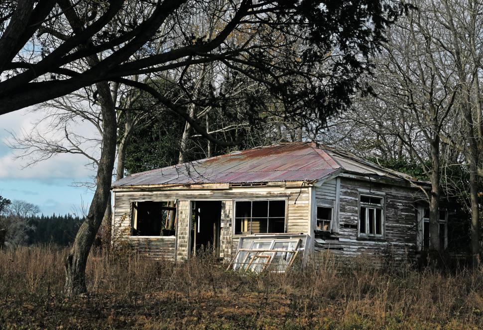 Free Image of Abandoned wooden house in desolate landscape 