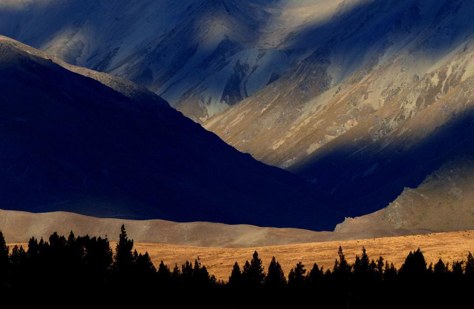 Free Image of Majestic mountain range with dynamic lighting 