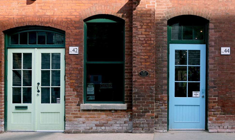 Free Image of Historic brick buildings with blue doors 
