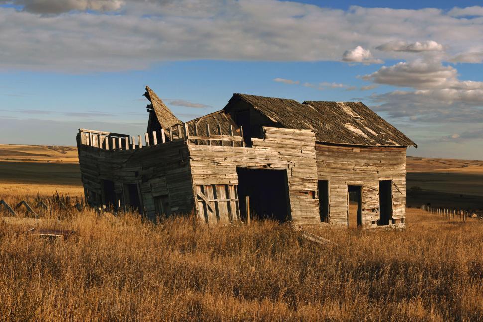 Free Image of Old wooden farmhouse abandoned in field 