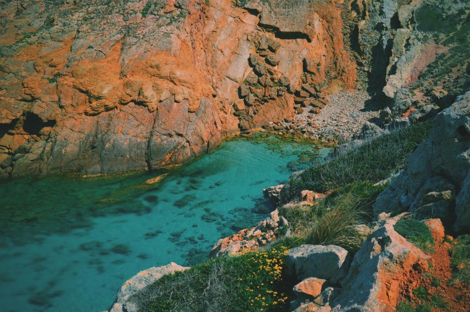 Free Image of Rocky cliff overlooking tranquil cove 