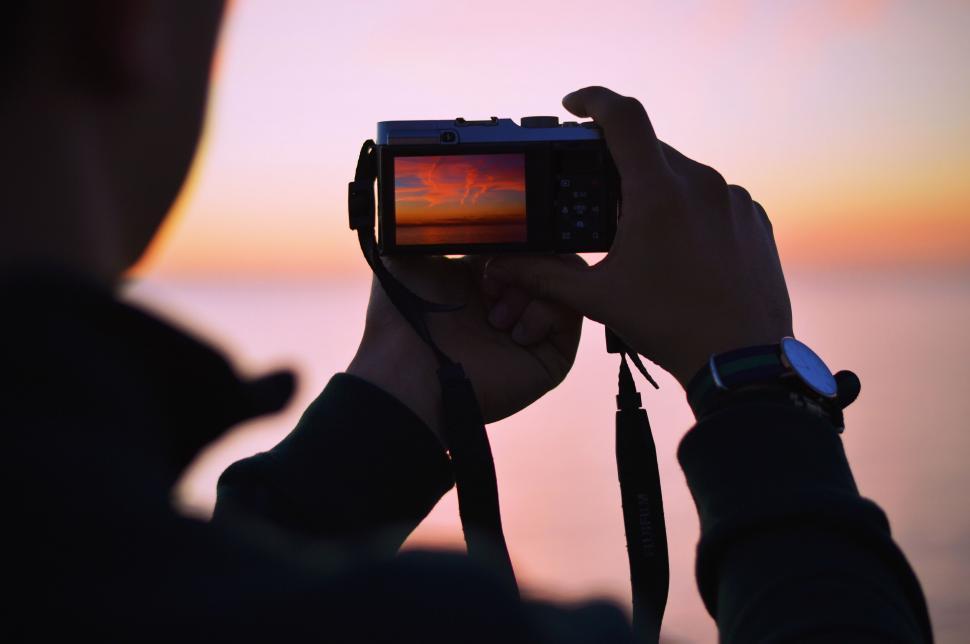 Free Image of Photographer capturing a sunset 