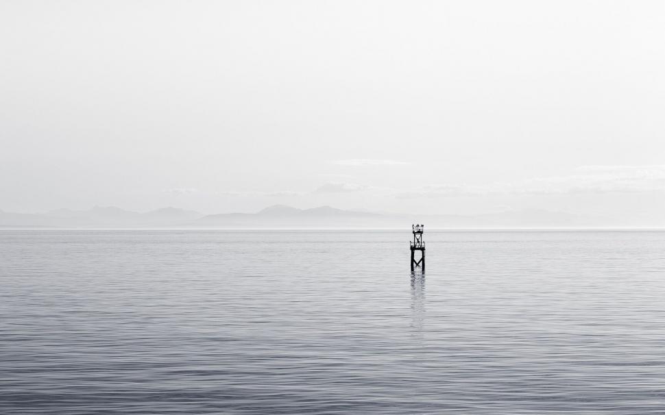 Free Image of Serene seascape with ocean and mountains 