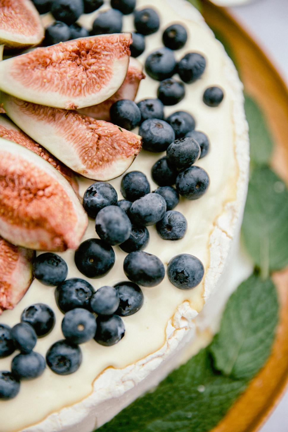 Free Image of Close-up of fresh fruit tart with figs and berries 