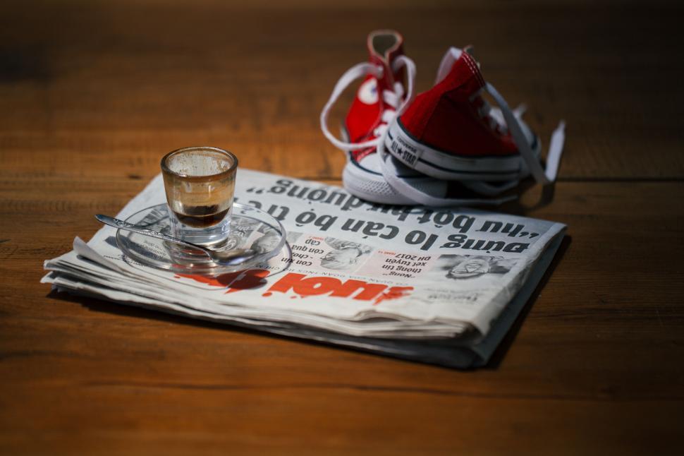 Free Image of News and coffee on a rustic table 