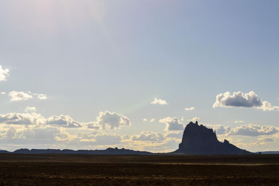 Free Image of Iconic Shiprock New Mexico against a vast sky 