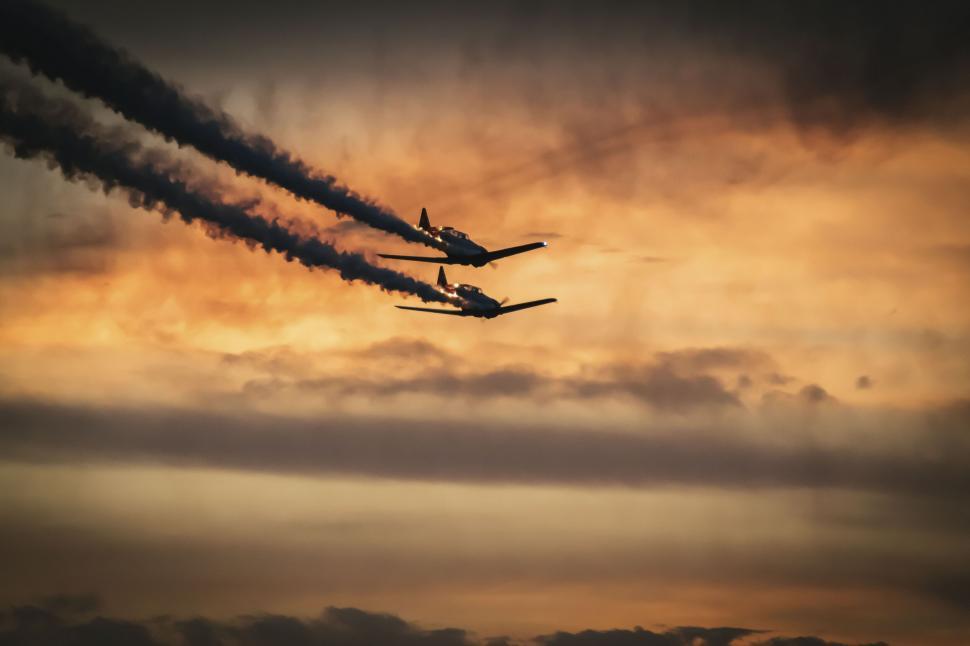 Free Image of Jets performing aerobatics at sunset 