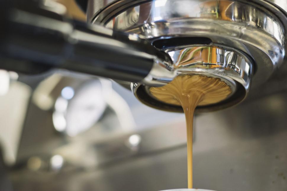 Free Image of Coffee machine pouring fresh espresso 