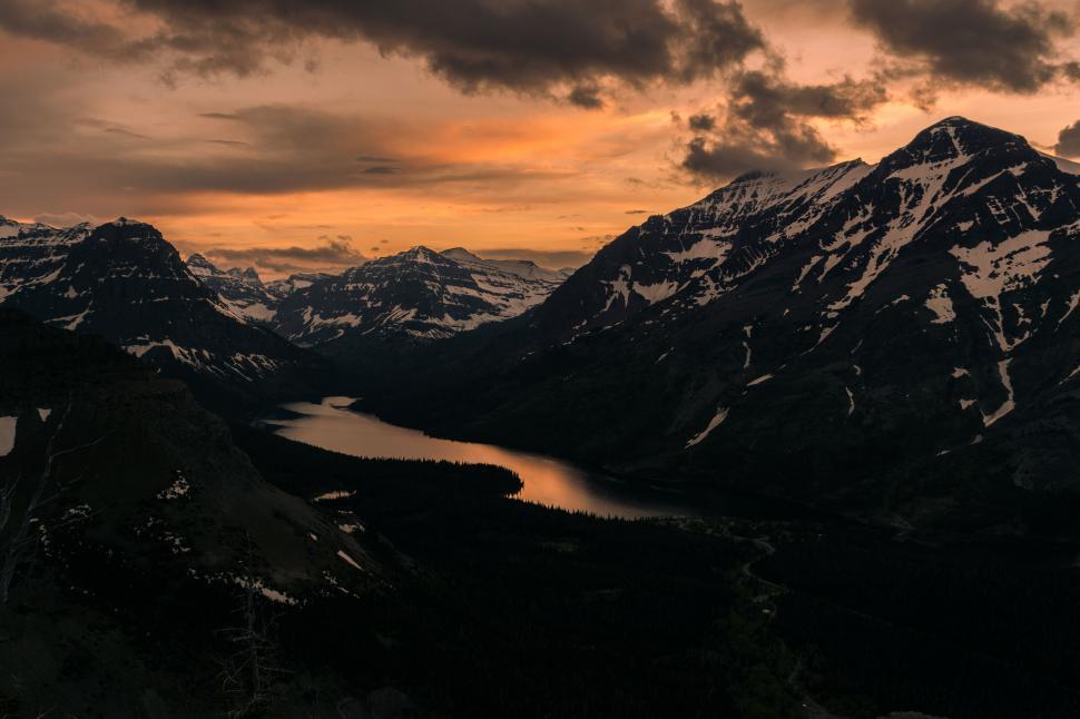 Free Image of Sunset over rugged mountain landscape 