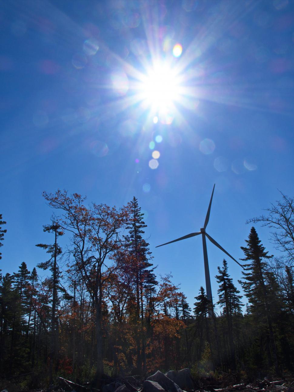 Free Image of Renewable energy wind turbine under sunny sky 