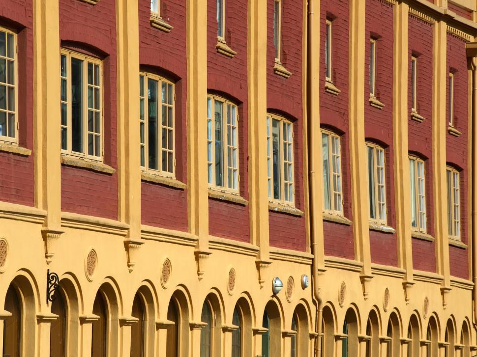 Free Image of Facade of a historic yellow brick building 