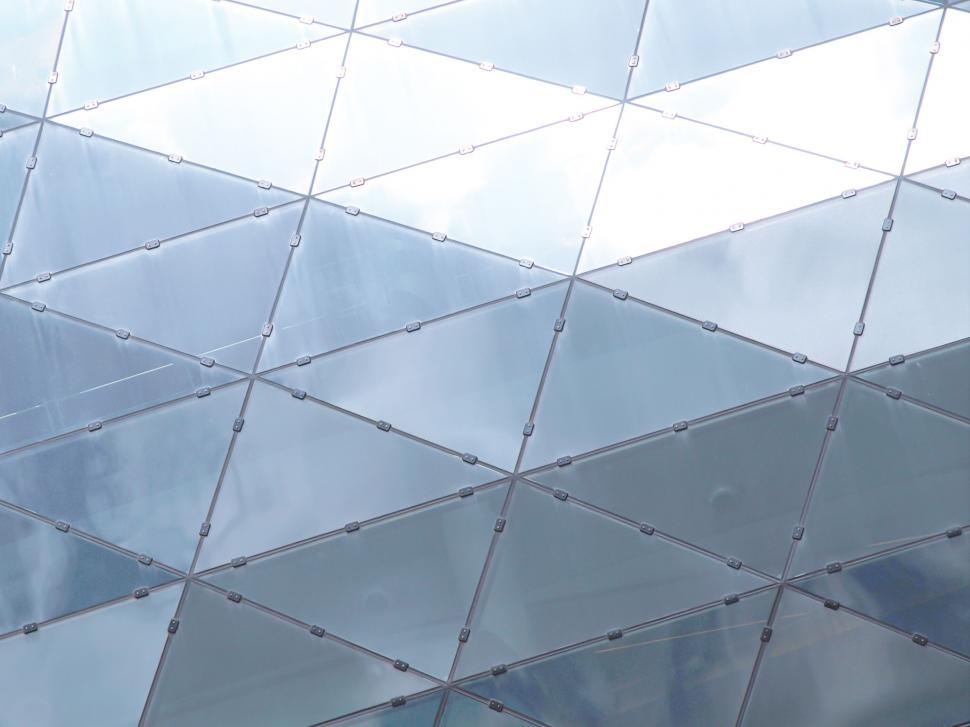 Free Image of Abstract pattern of geometric glass facade 