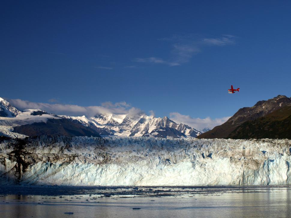 Free Image of Airplane flying over a stunning glacier 