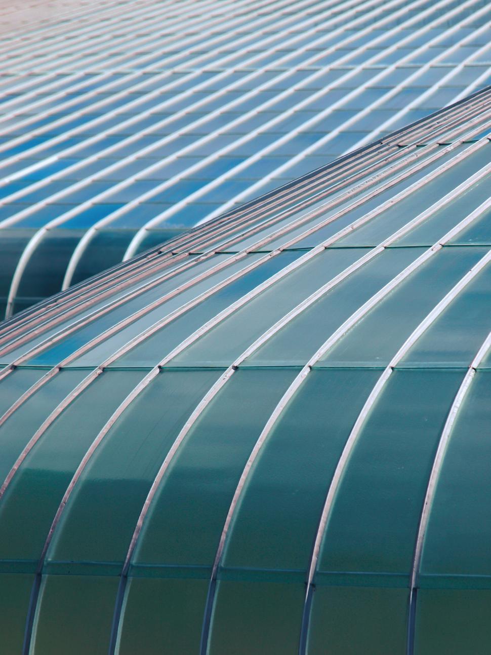 Free Image of Abstract view of teal architectural glass curves 