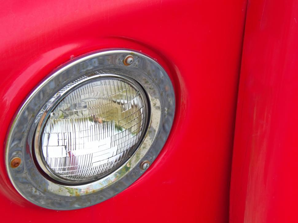 Free Image of Red vintage car headlight close-up 