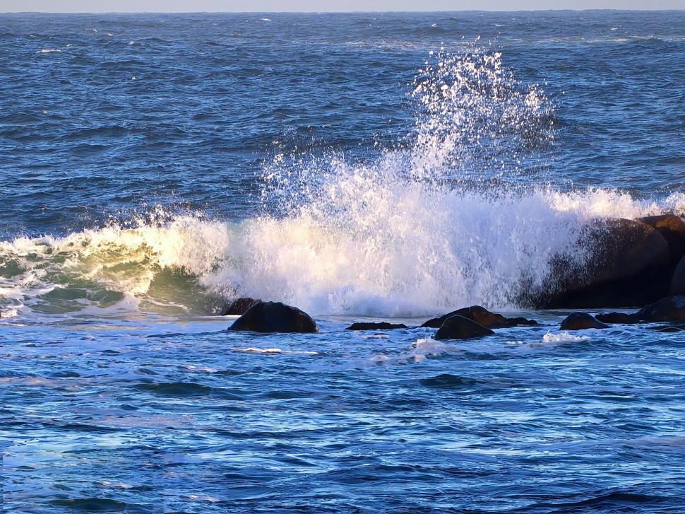 Free Image of Ocean waves crashing on coastal rocks 