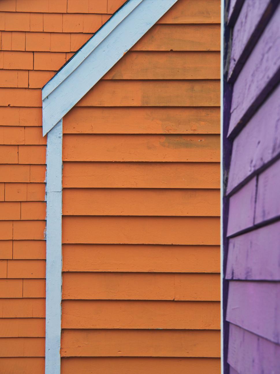 Free Image of Vibrant orange and purple wooden planks 