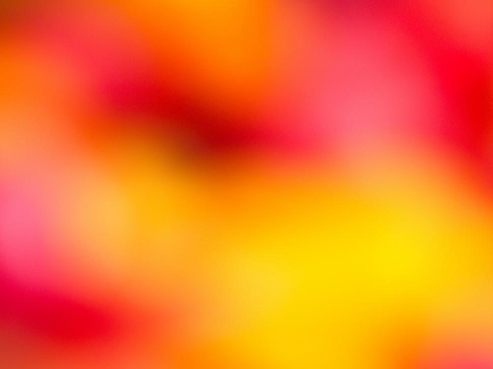 Free Image of Vibrant blur of warm colors and hues 