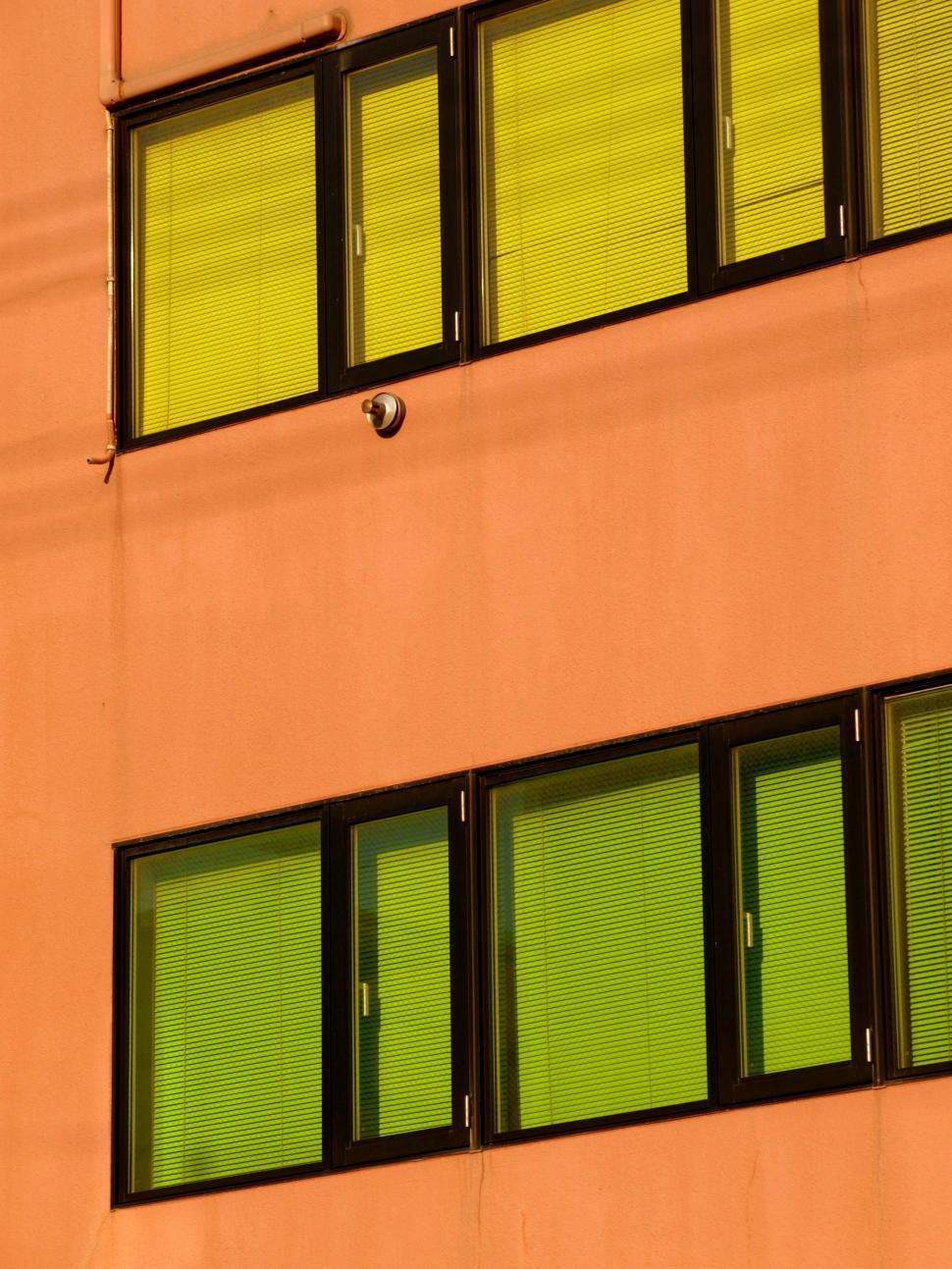Free Image of Geometric architecture and green windows 