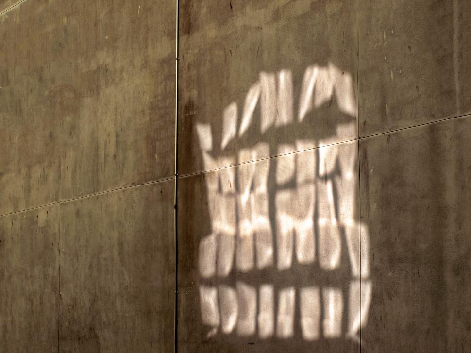 Free Image of Shadow patterns on a concrete wall 