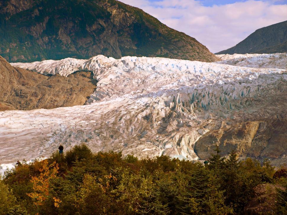 Free Image of Expansive glacier with autumn foliage in foreground 