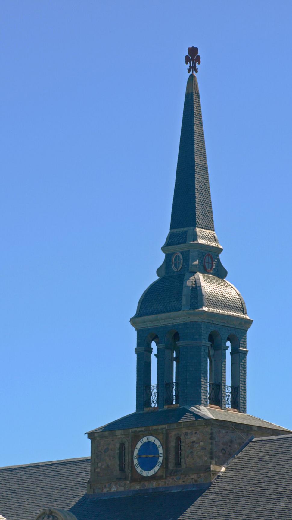 Free Image of Vintage Clock Tower against Clear Blue Sky 