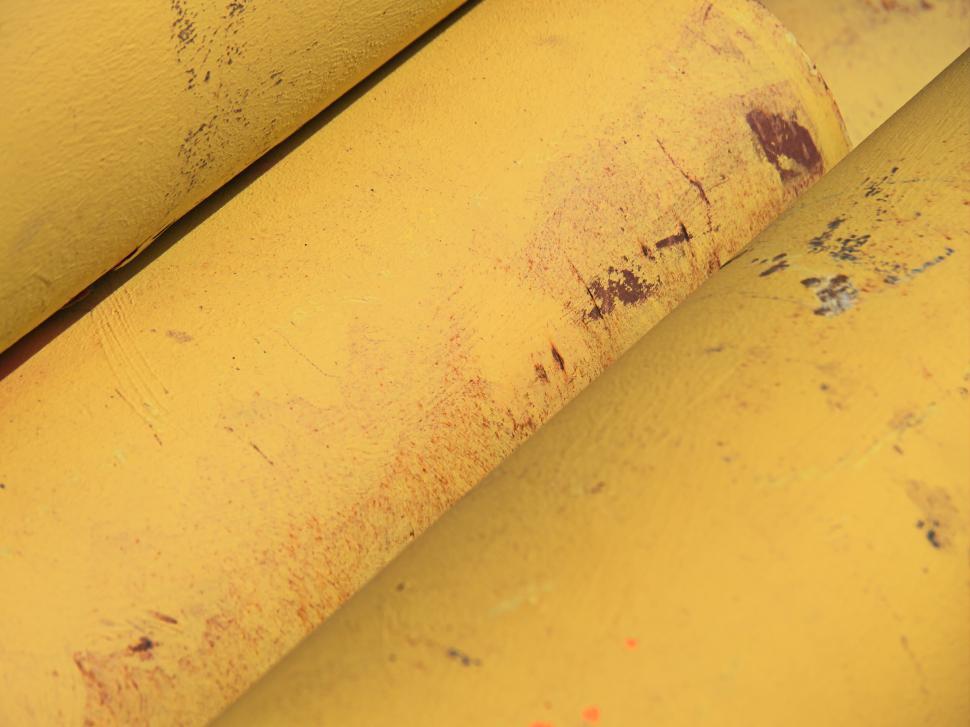 Free Image of Close-up of textured yellow industrial pipes 
