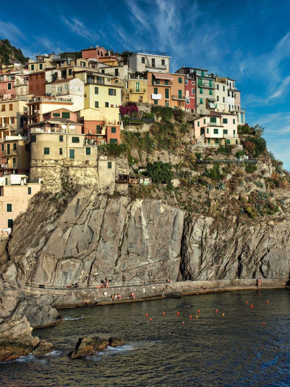 Free Image of Colorful houses clinging to an Italian cliff 