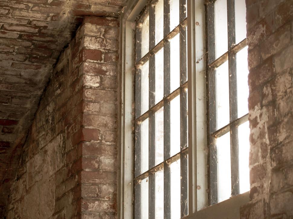 Free Image of Aged brick wall with barred window 