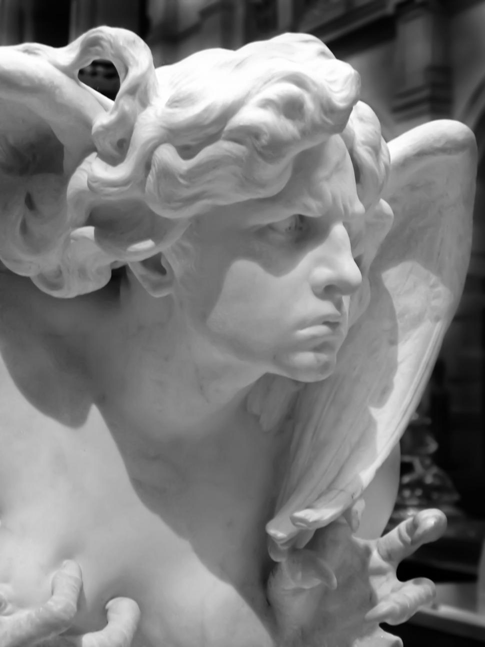 Free Image of Close-up on a stunning marble angel statue 
