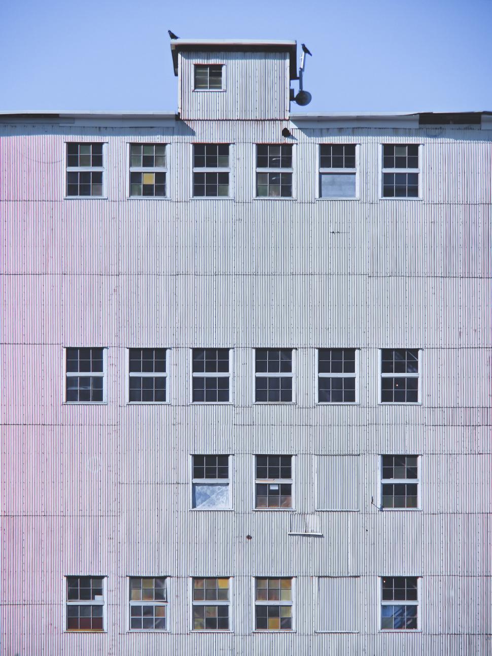 Free Image of Blue and pink industrial building facade 