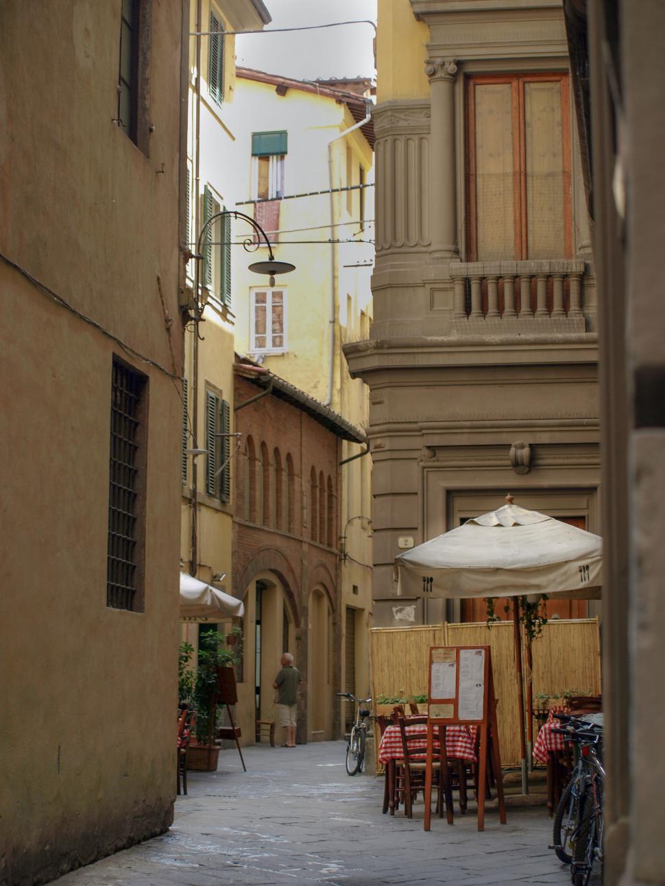 Free Image of Charming Italian street with outdoor dining 