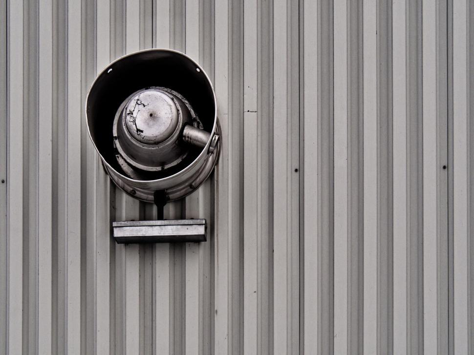Free Image of Industrial vent on a corrugated metal wall 