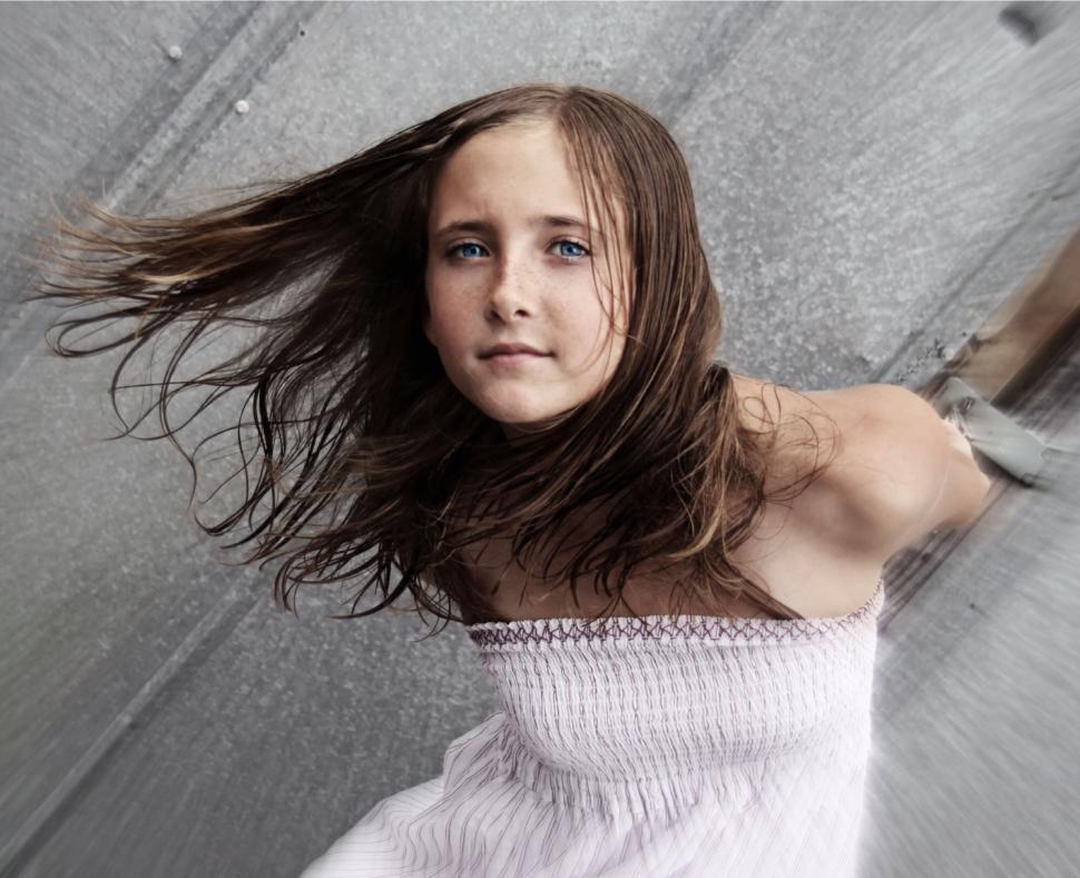 Free Image of Girl with flowing hair in dynamic pose 