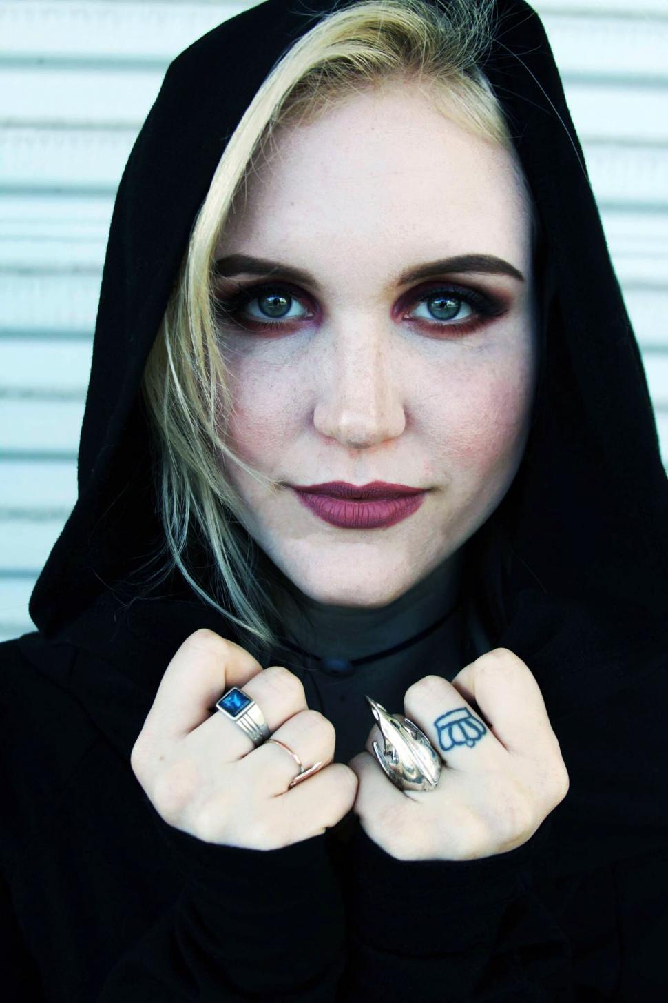 Free Image of Woman in black hood with dramatic makeup 