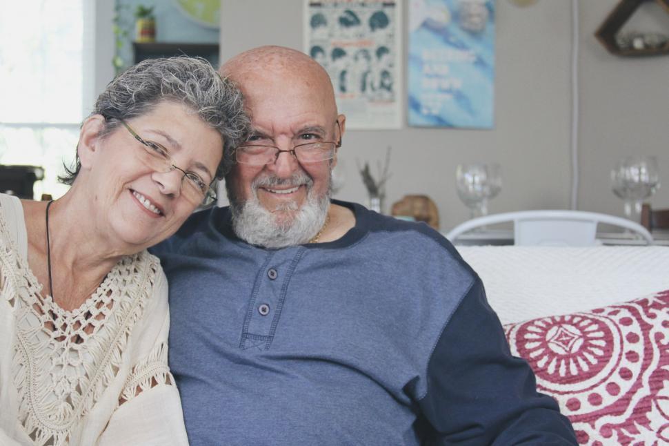Free Image of Senior couple smiling comfortably at home 
