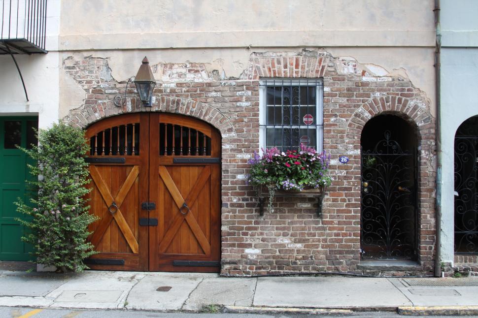 Free Image of Historic double doors on a brick building 