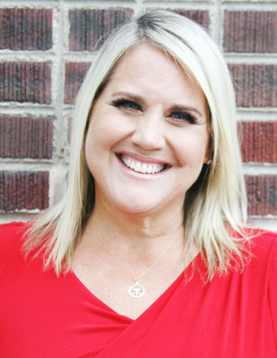 Free Image of Happy middle-aged woman in red smiling 