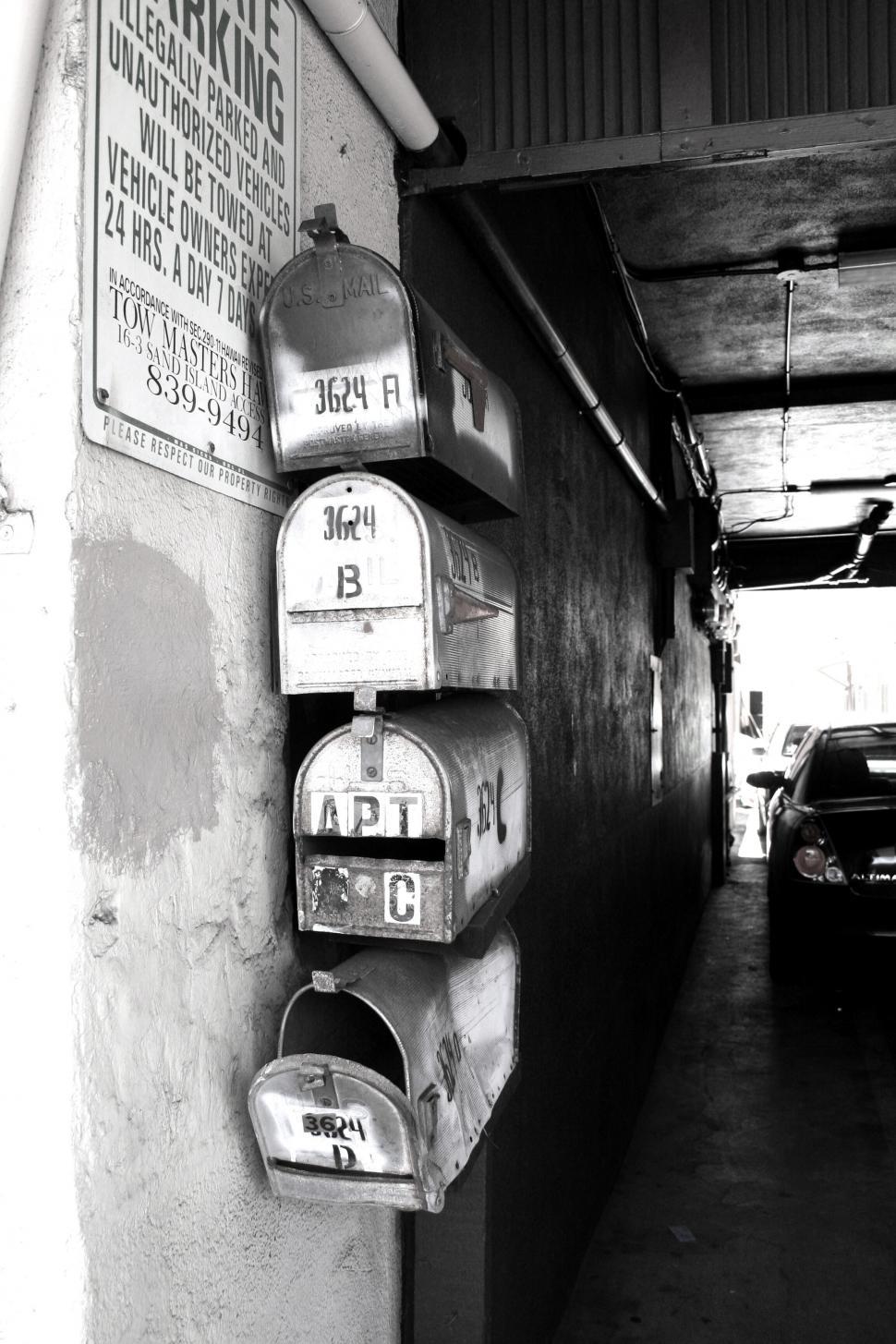 Free Image of Row of old rustic mailboxes in a building 