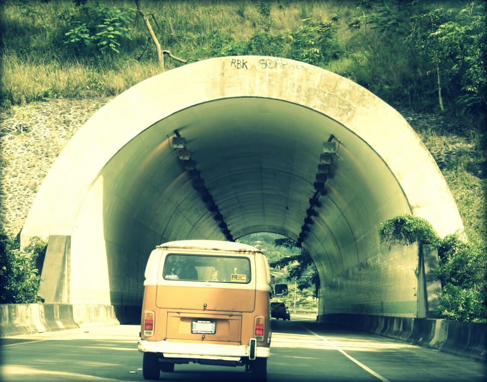 Free Image of Vintage Camper Entering a Tunnel Road 