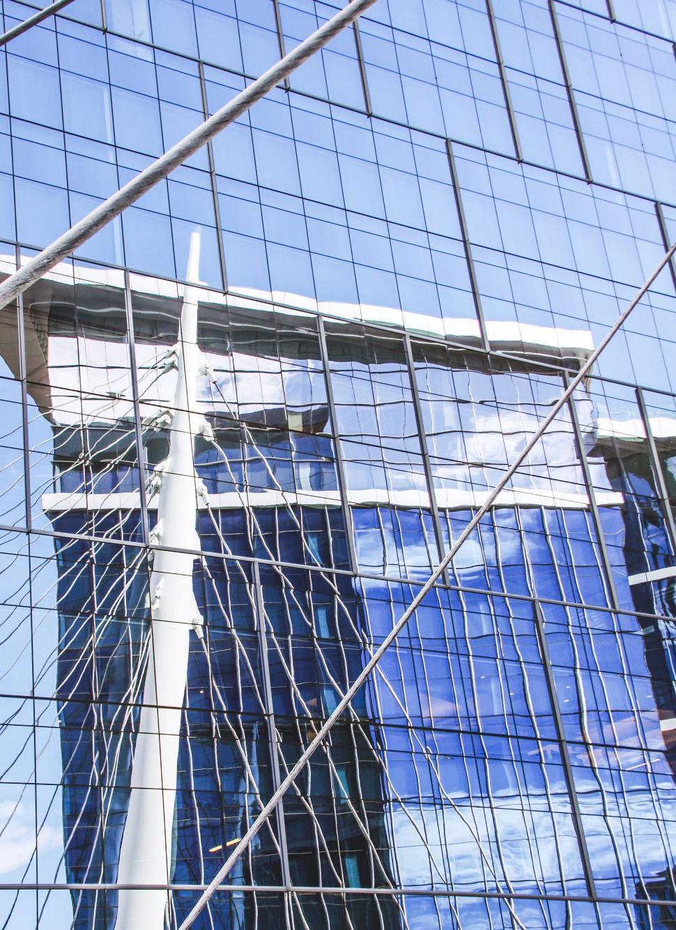 Free Image of Reflective Glass Facade of a Modern Building 