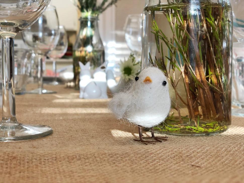Free Image of Decorative Bird and Floral Arrangement 