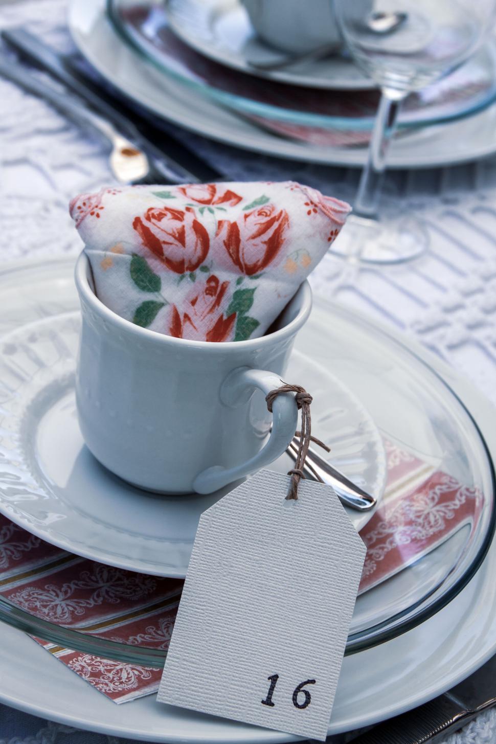 Free Image of Elegant table setting with floral napkin 