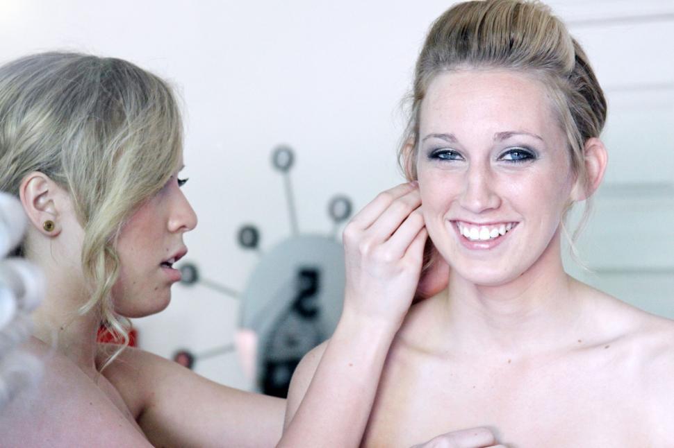 Free Image of Makeup artist working on smiling woman 