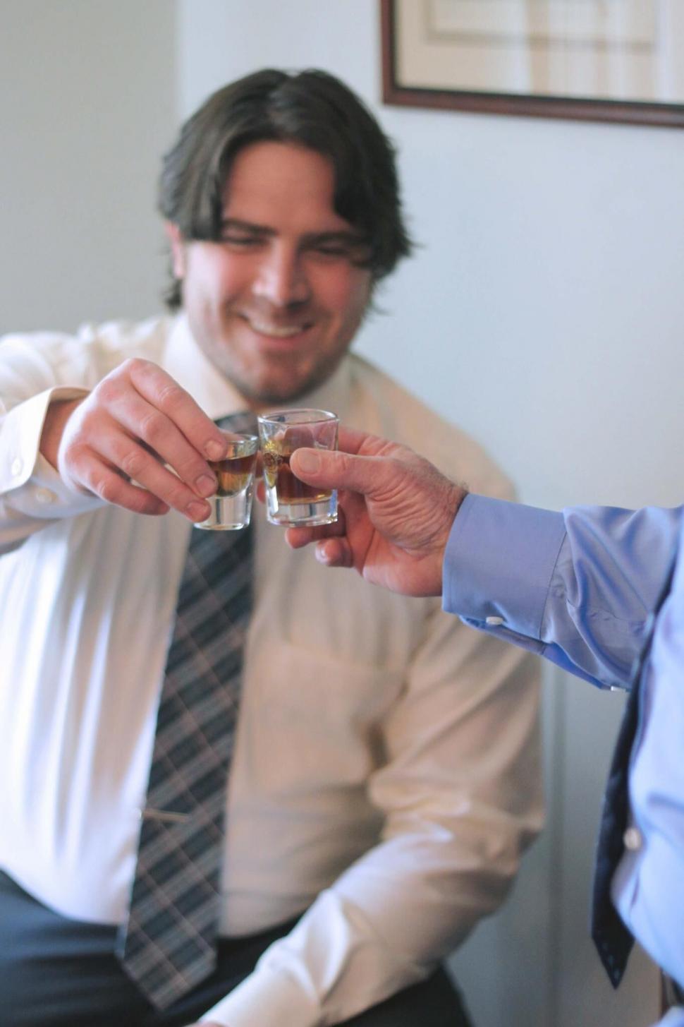 Free Image of Men toasting with shot glasses 